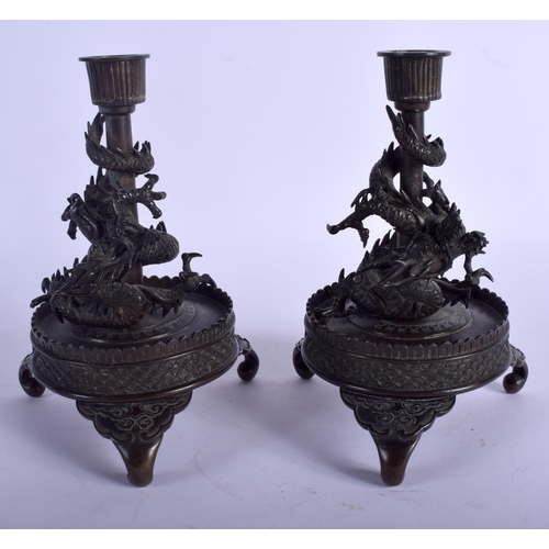 1230 - A PAIR OF 19TH CENTURY JAPANESE MEIJI PERIOD BRONZE DRAGON CANDLESTICKS upon circular bases. 18 cm x... 