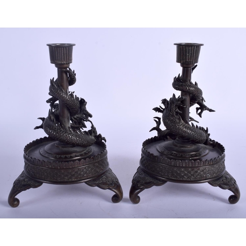 1230 - A PAIR OF 19TH CENTURY JAPANESE MEIJI PERIOD BRONZE DRAGON CANDLESTICKS upon circular bases. 18 cm x... 