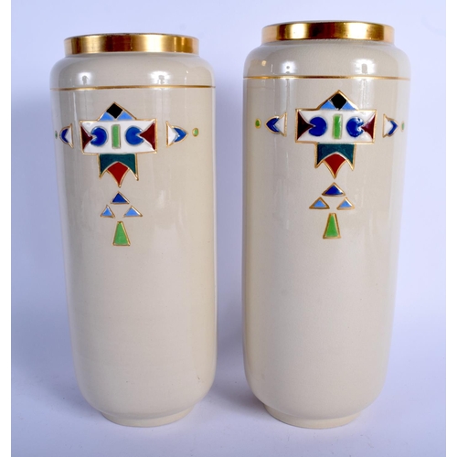 62 - A LARGE PAIR OF ART DECO FRENCH SARREGUEMINES VASES enamelled with motifs. 27 cm high.