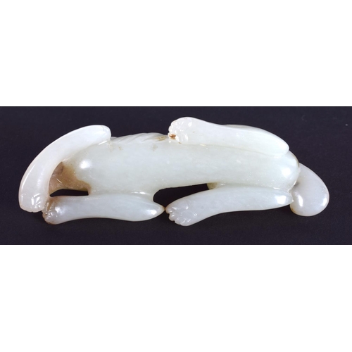 1239 - AN EARLY 20TH CENTURY CHINESE CARVED GREENISH WHITE JADE HOUND Late Qing/Republic. 7.25 cm wide.