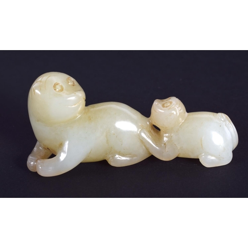 1240 - A CHINESE CARVED GREENISH WHITE JADE FIGURE 20th Century, modelled as two beasts. 6 cm wide.