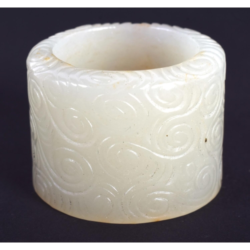 1241 - AN EARLY 20TH CENTURY CHINESE GREEN JADE ARCHERS RING Late Qing/Republic. 3.25 cm wide.