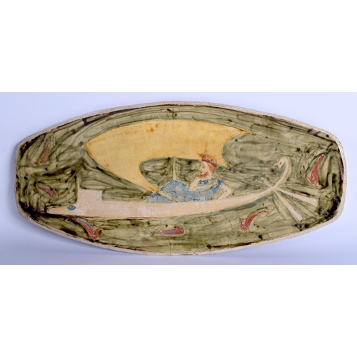 63 - AN UNUSUAL STUDIO POTTERY RECTANGULAR STONEWARE DISH painted with a reclining figure upon a Viking b... 