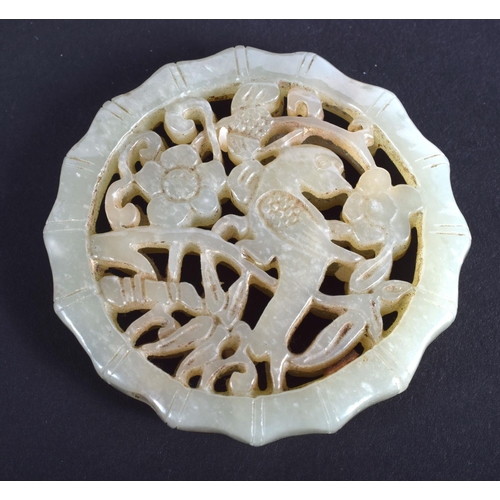 1254 - AN EARLY 20TH CENTURY CHINESE CARVED GREEN JADE OPENWORK PLAQUE Late Qing/Republic. 4.5 cm diameter.