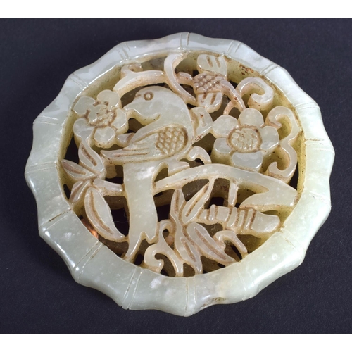 1254 - AN EARLY 20TH CENTURY CHINESE CARVED GREEN JADE OPENWORK PLAQUE Late Qing/Republic. 4.5 cm diameter.