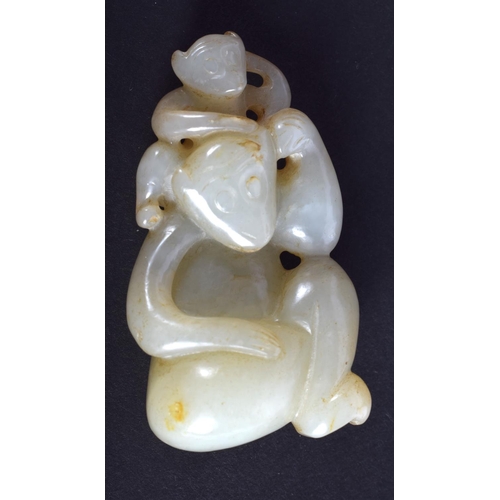 1258 - A CHINESE CARVED GREENISH WHITE JADE FIGURE OF MONKEYS 20th Century. 5.5 cm x 3.25 cm.