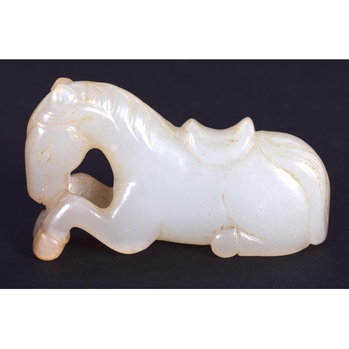 1260 - A CHINESE CARVED GREENISH WHITE JADE FIGURE OF A HORSE 20th Century. 4.5 cm x 2.75 cm.