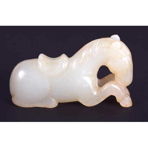 1260 - A CHINESE CARVED GREENISH WHITE JADE FIGURE OF A HORSE 20th Century. 4.5 cm x 2.75 cm.