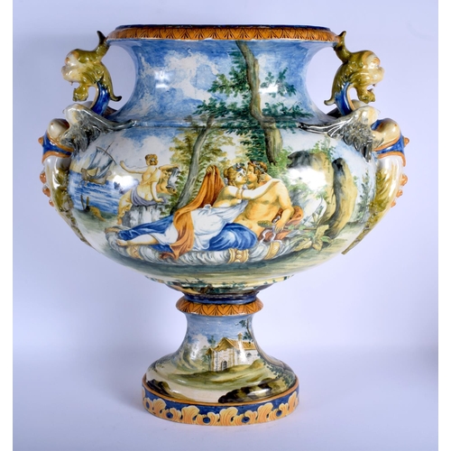 127 - A VERY LARGE 19TH CENTURY ITALIAN TWIN HANDLED MAJOLICA VASE painted with figures within landscapes.... 