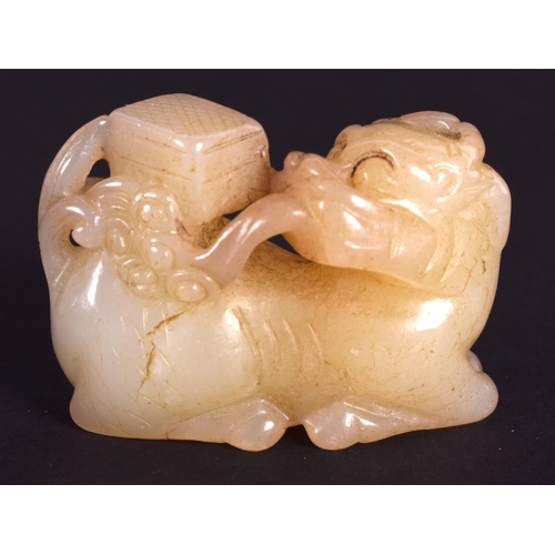 1270 - AN EARLY 20TH CENTURY CHINESE CARVED YELLOWISH HADE BEAST Late Qing/Republic. 4 cm x 3.25 cm.