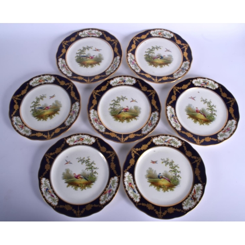 65 - A SET OF SEVEN ANTIQUE AYNSLEY PORCELAIN CABINET PLATES painted with birds and landscapes. 22 cm dia... 