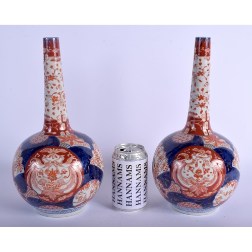 1302 - A PAIR OF 19TH CENTURY JAPANESE MEIJI PERIOD IMARI VASES painted with birds and flowers. 32 cm high.