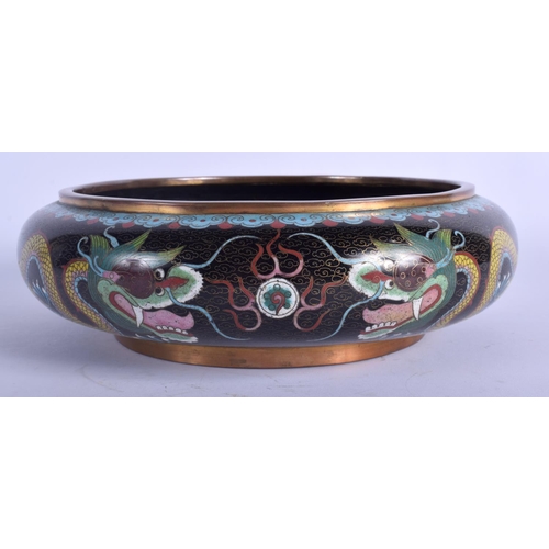 1307 - A LARGE EARLY 20TH CENTURY CHINESE CLOISONNE ENAMEL BOWL decorated with dragons. 23 cm diameter.