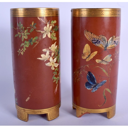 67 - A RARE PAIR OF MINTON ARTS AND CRAFTS POTTERY VASES enamelled with fruiting vines. 20 cm high.