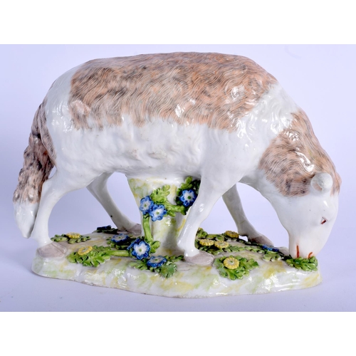 131 - A 19TH CENTURY CONTINENTAL PORCELAIN MODEL OF A SHEEP modelled upon flower encrusted bases. 18 cm x ... 