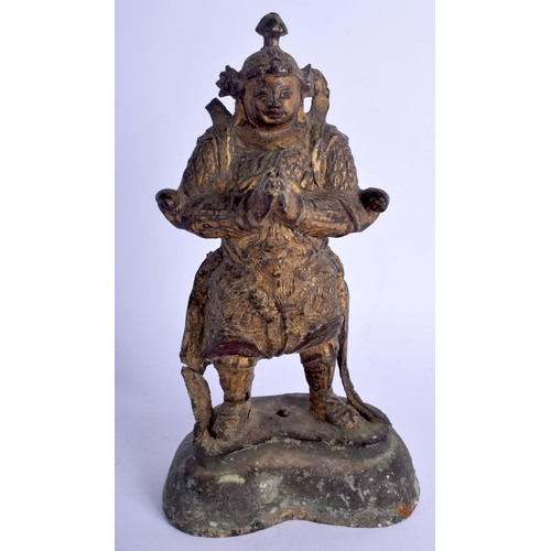 1312 - A 17TH/18TH CENTURY CHINESE BRONZE FIGURE OF A STANDING GUARDIAN Ming, modelled with hands clasped. ... 