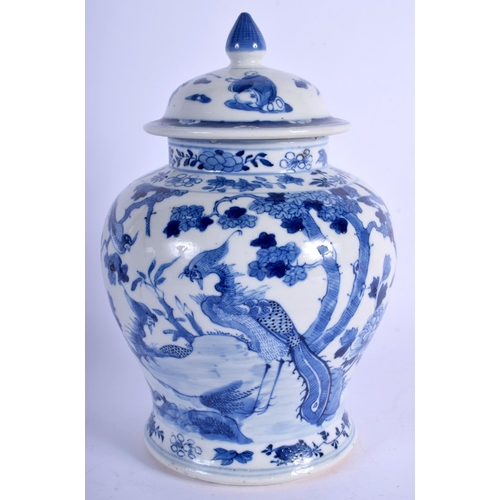 1334 - A 19TH CENTURY CHINESE BLUE AND WHITE VASE AND COVER bearing Qianlong marks to base. 23.5 cm high.