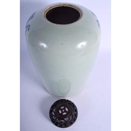 1339 - A 19TH CENTURY CHINESE BLUE AND WHITE CELADON VASE AND COVER Qing. 33 cm high.