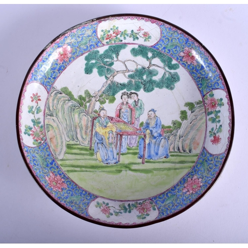 1349 - AN 18TH CENTURY CHINESE CANTON ENAMEL CIRCULAR DISH Qianlong mark and period, painted with figures i... 