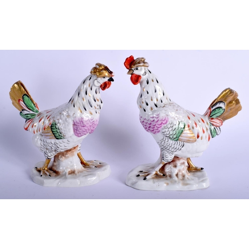 77 - A PAIR OF EARLY 20TH CENTURY GERMAN PORCELAIN BIRDS modelled upon a naturalistic base. 17 cm x 10 cm... 