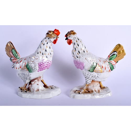 77 - A PAIR OF EARLY 20TH CENTURY GERMAN PORCELAIN BIRDS modelled upon a naturalistic base. 17 cm x 10 cm... 