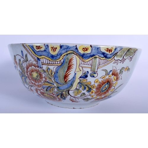 78 - A LARGE DELFT TIN GLAZED NELSON POTTERY BOWL possibly 19th century, painted with foliage and ships. ... 