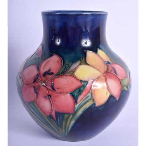 83 - A WILLIAM MOORCROFT VASE painted with foliage. 13.5 cm high.