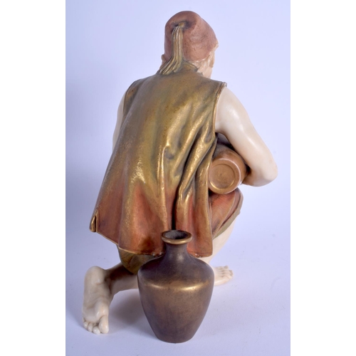 90 - A RARE 19TH CENTURY ROYAL WORCESTER BLUSH IVORY FIGURE modelled as a male pouring a water vessel. 17... 