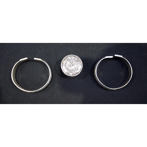 3020 - Two Chinese white metal bangles and a white metal coin box