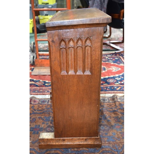 3107 - A small oak Lizard Man Lectern with a fine religious carving to the front.  72cm x 65cm