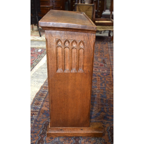 3107 - A small oak Lizard Man Lectern with a fine religious carving to the front.  72cm x 65cm