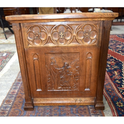 3107 - A small oak Lizard Man Lectern with a fine religious carving to the front.  72cm x 65cm