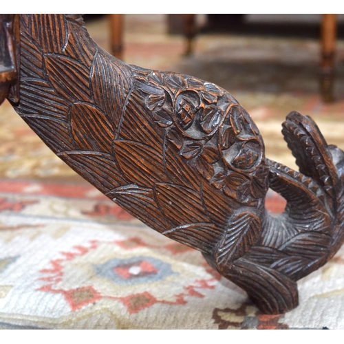 3115 - Burmese carved Table with ornate dragon legs and foliage to top.  68cm x 70cm