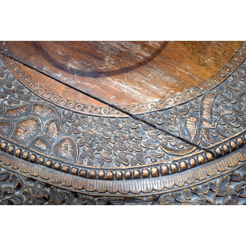 3115 - Burmese carved Table with ornate dragon legs and foliage to top.  68cm x 70cm