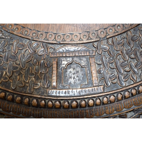 3115 - Burmese carved Table with ornate dragon legs and foliage to top.  68cm x 70cm