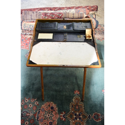 3122 - A Campaign Writing Table with fold down top.  76cm x 65cm