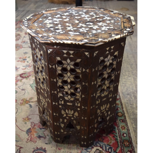 3126 - Ornately carved Syrian Table inset with mother of pearl and a Lacquer Table.  66cm x 65cm. (2)