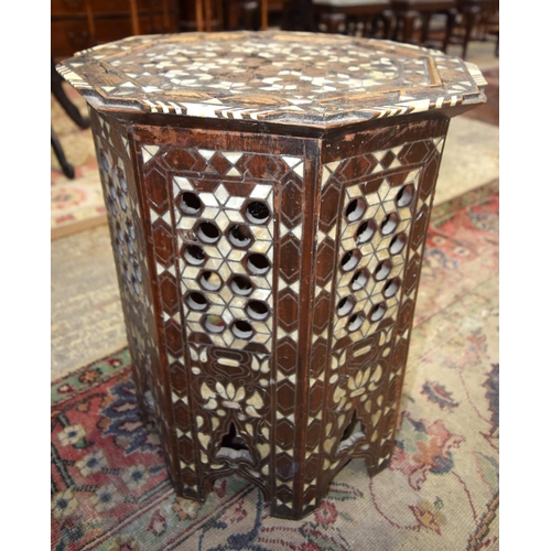 3126 - Ornately carved Syrian Table inset with mother of pearl and a Lacquer Table.  66cm x 65cm. (2)