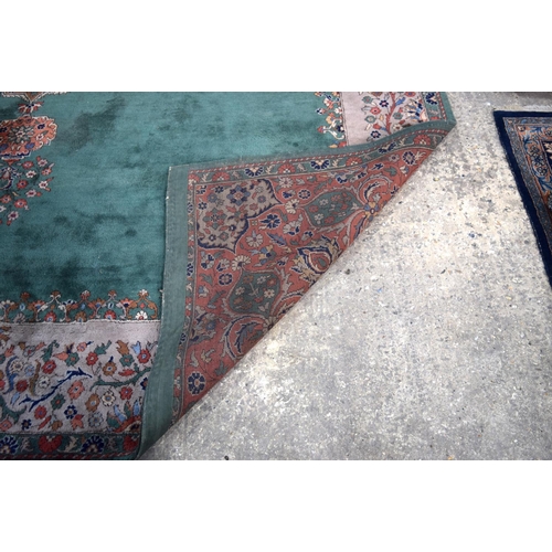 3135 - A Large country house Green Ground Persian rug.  542cm x 367cm