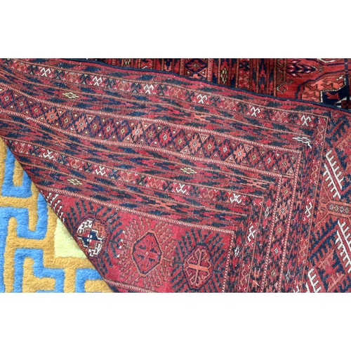 3136 - A Large red ground Oriental rug.  350cm x 250cm