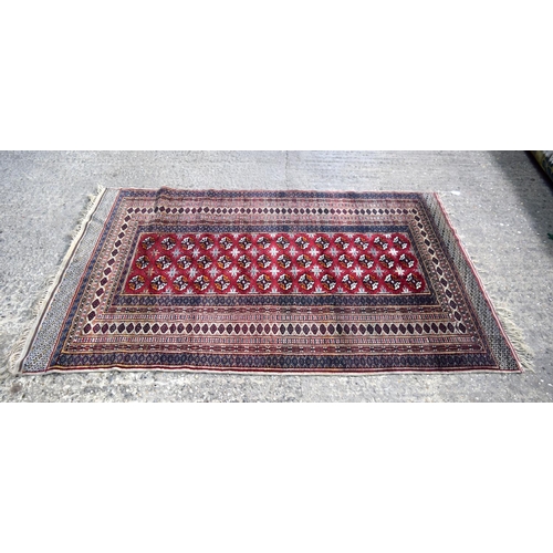 3138 - Red ground oriental rug.  188cm x 123cm