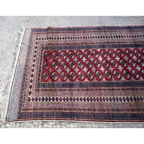 3138 - Red ground oriental rug.  188cm x 123cm