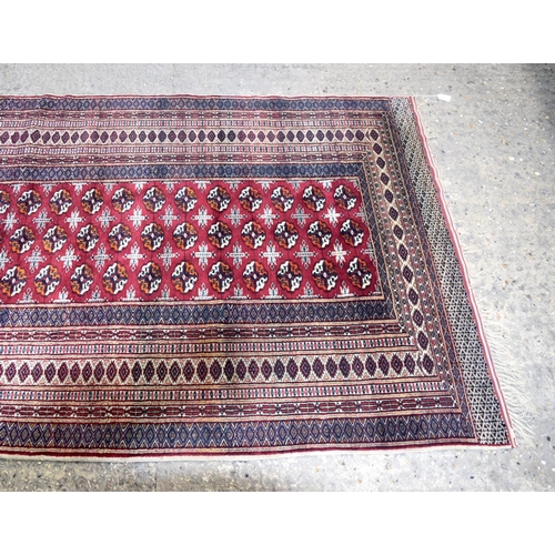 3138 - Red ground oriental rug.  188cm x 123cm