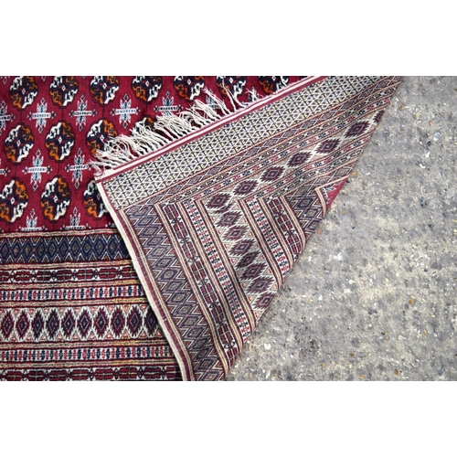 3138 - Red ground oriental rug.  188cm x 123cm