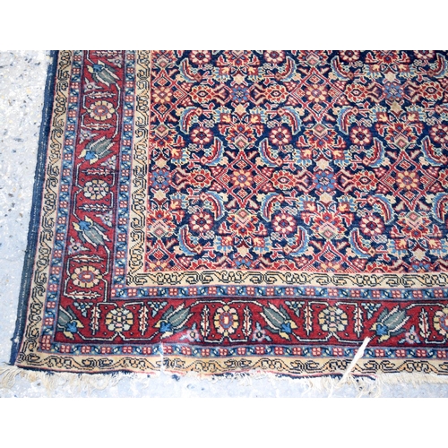 3143 - A Turkman red ground rug.  190cm x 140cm