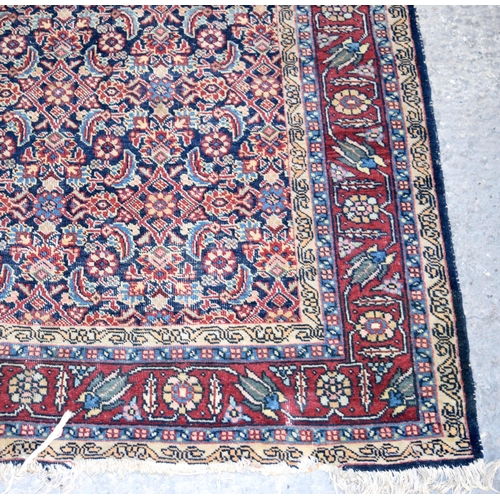 3143 - A Turkman red ground rug.  190cm x 140cm