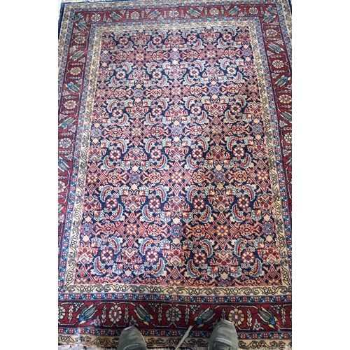 3143 - A Turkman red ground rug.  190cm x 140cm