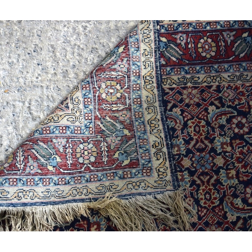 3143 - A Turkman red ground rug.  190cm x 140cm