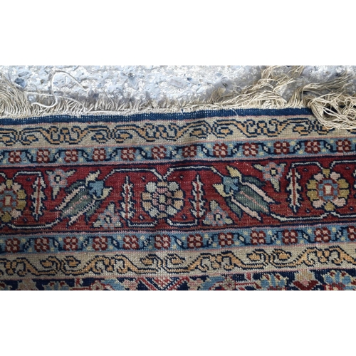 3143 - A Turkman red ground rug.  190cm x 140cm