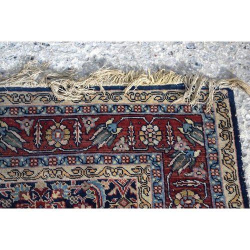 3143 - A Turkman red ground rug.  190cm x 140cm